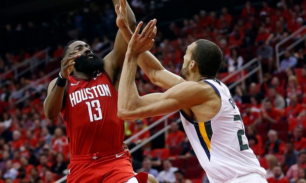 James Harden #13 of the Houston Rockets shoots a floater over Rudy Gobert #27 of the Utah Jazz duri...