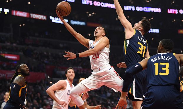 Landry Shamet #20 of the LA Clippers scores past Georges Niang #31 of the Utah Jazz during the firs...