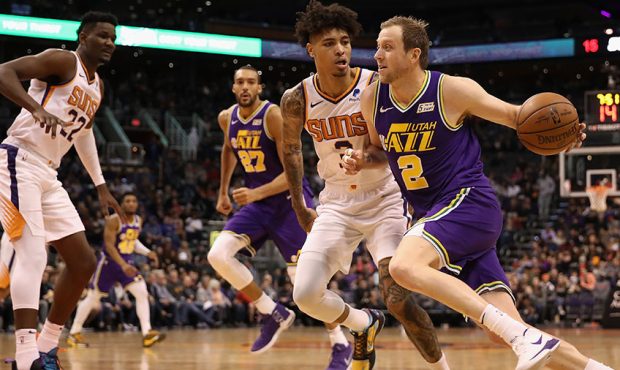 Joe Ingles #2 of the Utah Jazz drives the ball past Kelly Oubre Jr. #3 of the Phoenix Suns during t...