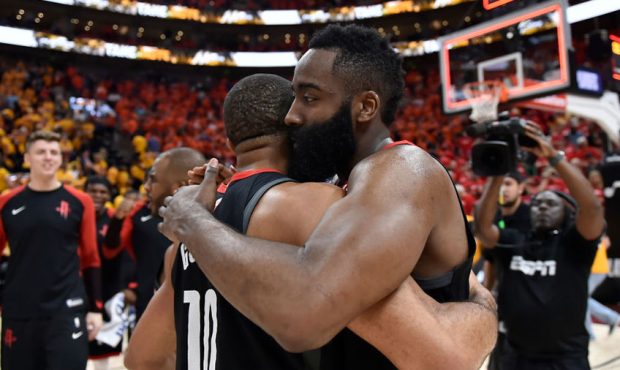 Eric Gordon #10 and James Harden #13 of the Houston Rockets embrace after their 104-101 win over th...