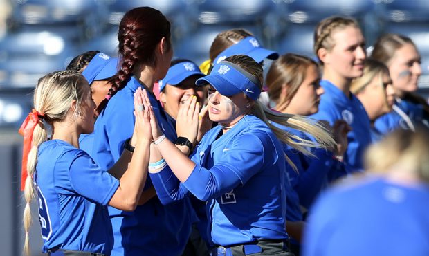 BYU's Rylee Jensen greets teammates during player introductions as BYU and Utah play in a softball ...