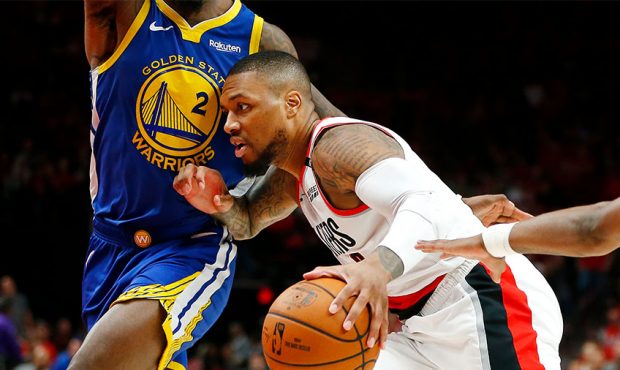 Damian Lillard #0 of the Portland Trail Blazers dribbles during the second half against the Golden ...