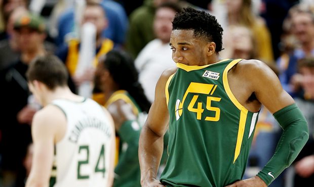 Utah Jazz guard Donovan Mitchell (45) tucks his face in his jersey after missing two free throws in...