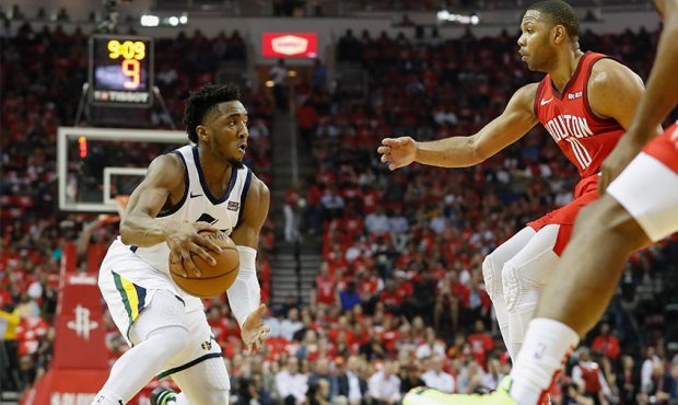 Donovan Mitchell #45 of the Utah Jazz dribbles the ball defended by Eric Gordon #10 of the Houston ...