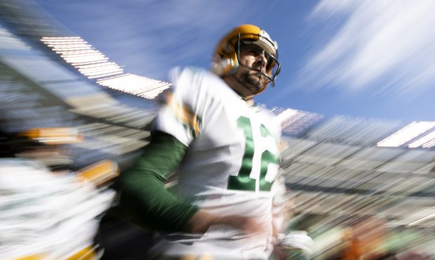 EAST RUTHERFORD, NEW JERSEY - DECEMBER 23: Aaron Rodgers #12 of the Green Bay Packers enters before...