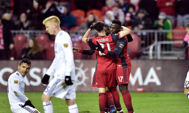 Toronto FC forward Jozy Altidore (17) celebrates his second goal with teammate Jonathan Osorio (21)...