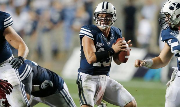 Quarterback Riley Nelson of BYU looks to pass during the second half of an college football game ag...