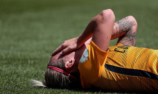 Utah Royals FC midfielder Gunnhildur Jonsdottir (66) lays on the grass after falling hard during th...