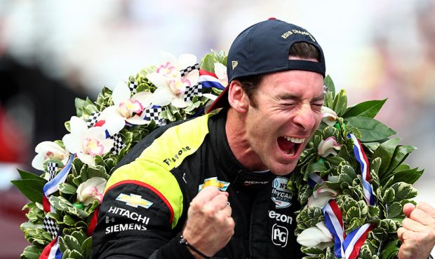 Simon Pagenaud of France, driver of the #22 Team Penske Chevrolet celebrates winning the 103rd Indi...