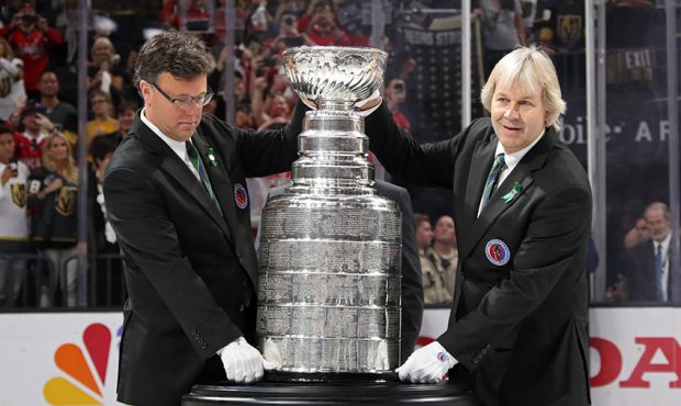 Craig Campbell, left, and Phil Pritchard, The Keepers of the Stanley Cup, bring the Stanley Cup ont...