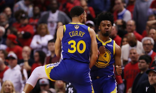 Quinn Cook #4 and Stephen Curry #30 of the Golden State Warriors celebrate the play against the Tor...