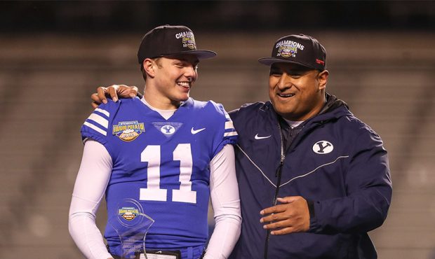 Quarterback Zach Wilson #11(MVP) and Head Coach Kalani Sitake of the BYU Cougars celebrate during t...