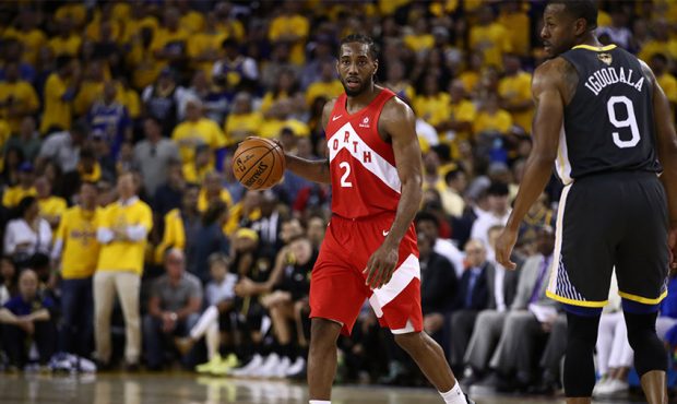 Kawhi Leonard #2 of the Toronto Raptors handles the ball on offense against the Golden State Warrio...