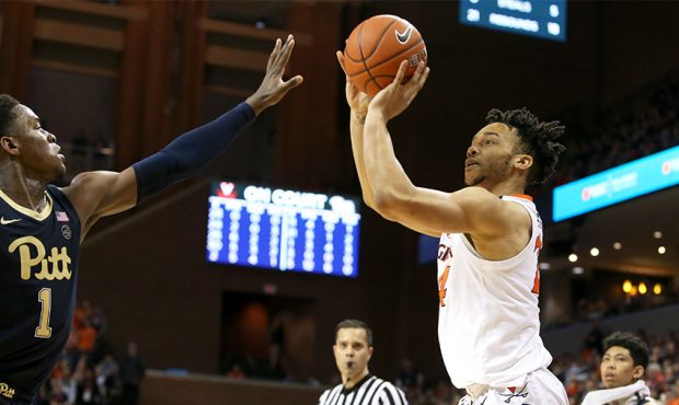 Marco Anthony #24 of the Virginia Cavaliers shoots over Xavier Johnson #1 of the Pittsburgh Panther...
