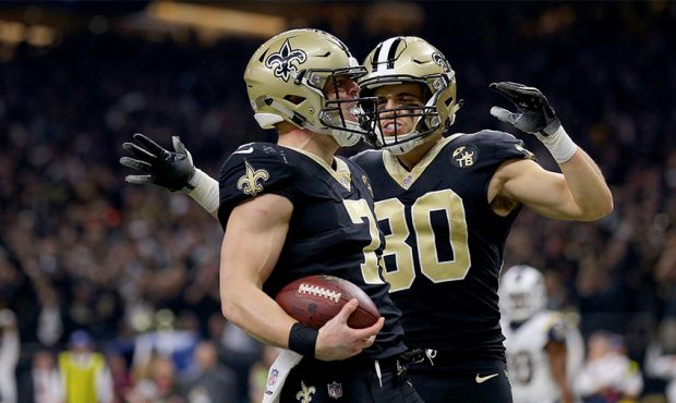 Taysom Hill #7 of the New Orleans Saints celebrates with Austin Carr #80 after scoring a touchdown ...