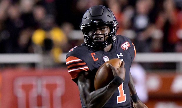 Quarterback Tyler Huntley #1 of the Utah Utes runs for a first down in the first half of a game aga...