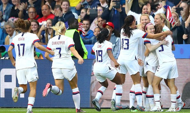 Lindsey Horan of the USA celebrates with teammates after scoring her team's first goal during the 2...