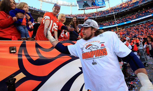 Zane Beadles #68 of the Denver Broncos celebrates after they defeated the New England Patriots 26 t...