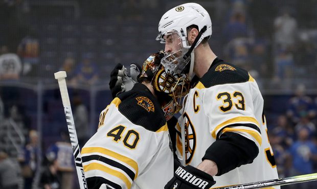 Tuukka Rask #40 and Zdeno Chara #33 of the Boston Bruins celebrate their teams 5-1 win over the St....