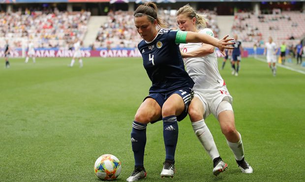 Rachel Corsie of Scotland battles for possession with Ellen White of England during the 2019 FIFA W...