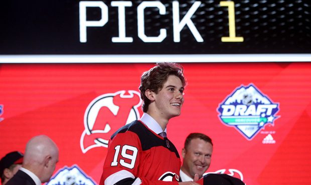 Jack Hughes smiles after being selected first overall by the New Jersey Devils during the first rou...