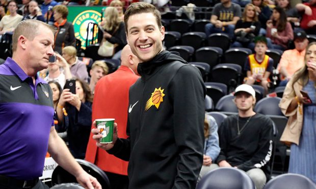 Phoenix Suns guard Jimmer Fredette (32) smiles at fans before playing in an NBA basketball game aga...