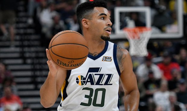 Naz Mitrou-Long #30 of the Utah Jazz brings the ball up court in a preseason NBA game against the A...