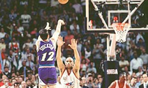 John Stockton releases a game-winning three against the Houston Rockets in Game 6 May 29, 1997. (Gl...
