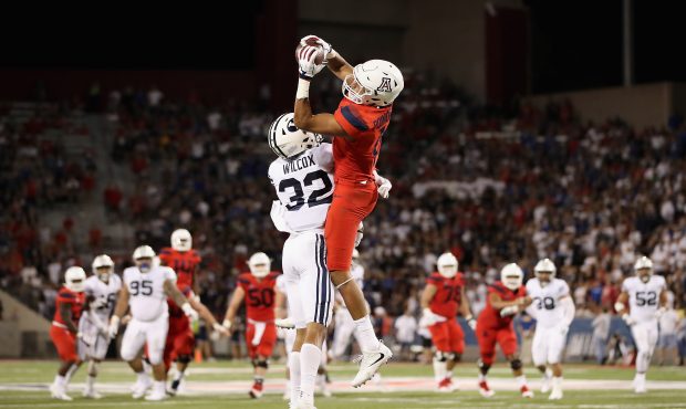 TUCSON, AZ - SEPTEMBER 01:  Wide receiver Shawn Poindexter #19 of the Arizona Wildcats makes a leap...