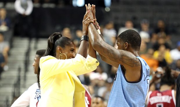 Head coach Lisa Leslie of Triplets celebrates with Joe Johnson #1 after defeating Tri State on a fo...