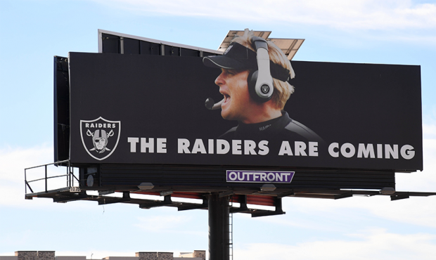 LAS VEGAS, NEVADA - DECEMBER 20: A billboard featuring the words "THE RAIDERS ARE COMING" and an im...