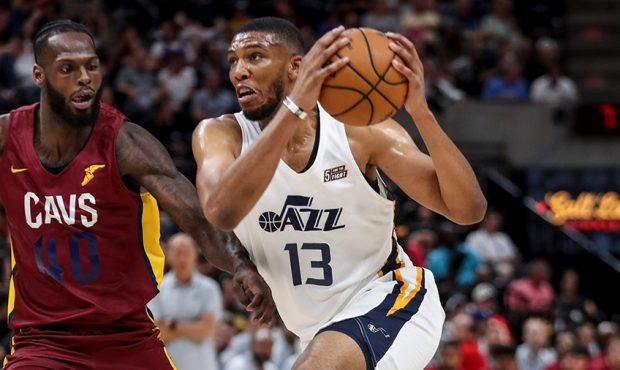Utah Jazz center Tony Bradley, right, drives past Jacorey Williams of the Cleveland Cavaliers durin...