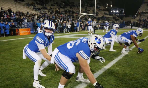 BYU center James Empey prepares to snap the ball to quarterback Zach Wilson during warmups in Provo...