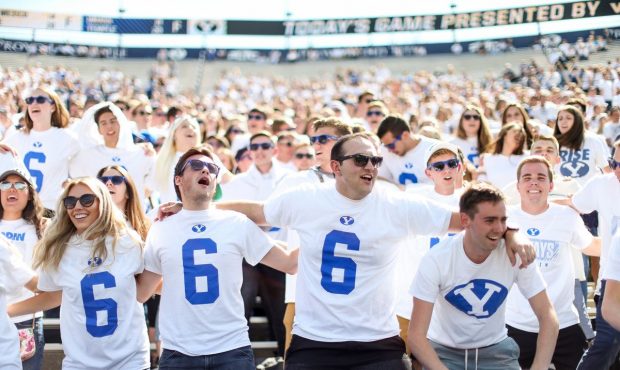 Brigham Young Cougars fans cheer before the game against the Wisconsin Badgers at LaVell Edwards St...