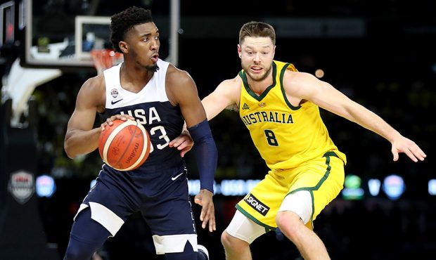 Donovan Mitchell of the USA and Matthew Dellavedova of the Boomers during game two of the Internati...