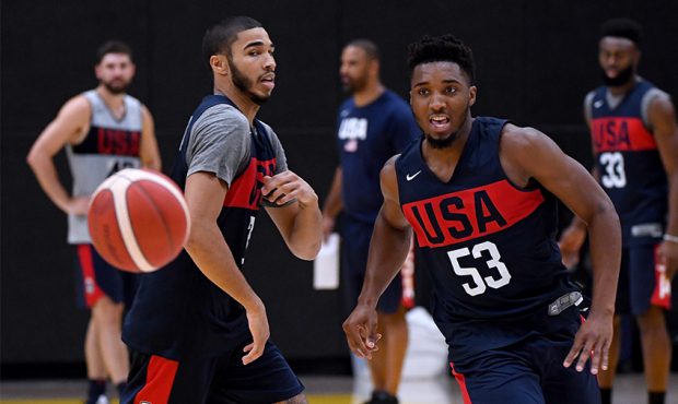 Donovan Mitchell #53 chases after his pass in front of Jayson Tatum #34 during the 2019 USA Men's N...