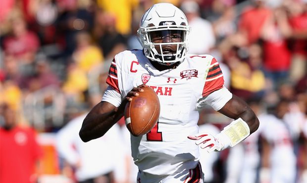 Quarterback Tyler Huntley #1 of the Utah Utes drops back to pass during the first half of the colle...