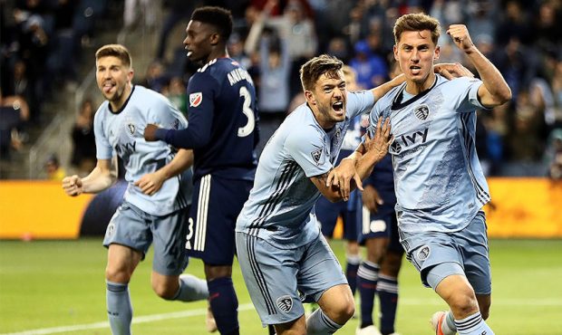 Krisztian Nemeth #9 of Sporting Kansas City celebrates with Kelyn Rowe #11 after scoring during the...