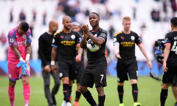 Raheem Sterling of Manchester City holds the match ball as he applauds fans after the Premier Leagu...