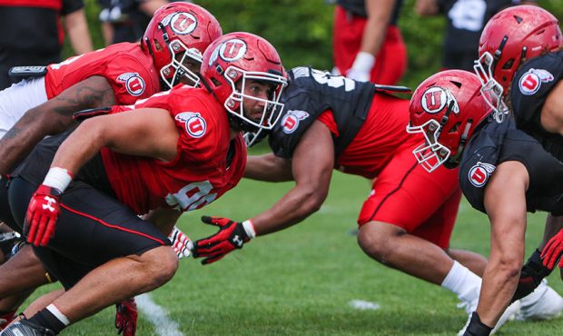 University of Utah's offensive line faces the defensive line during fall camp practice. (Photo cour...
