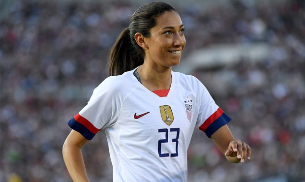 Christen Press #23 of the United States smiles as she receives a cheer from the crowd before her co...