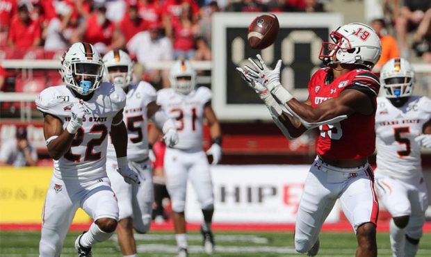 Utah Utes wide receiver Bryan Thompson catches a pass and runs for a touchdown against the Idaho St...