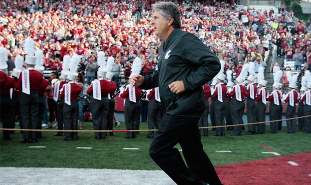 Head coach Mike Leach of the Washington State Cougars takes the field prior to the start of the gam...