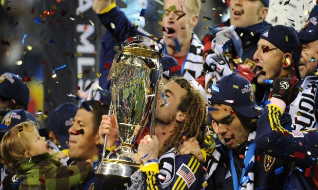 Kyle Beckerman #5 of Real Salt Lake kisses the The Philip F. Anschutz MLS Cup trophy as he and his ...