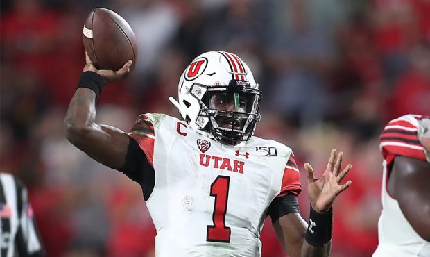 Quarterback Tyler Huntley #1 of the Utah Utes looks to pass against the USC Trojans at Los Angeles ...