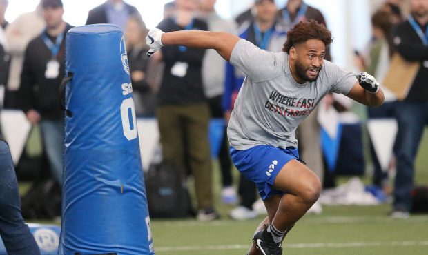 Brigham Young Cougars linebacker Harvey Langi (21) works out during Pro Day in Provo on Friday, Mar...