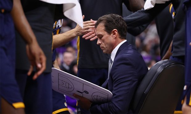 Head coach Quin Snyder of the Utah Jazz sits with his team during a time out in their game against ...