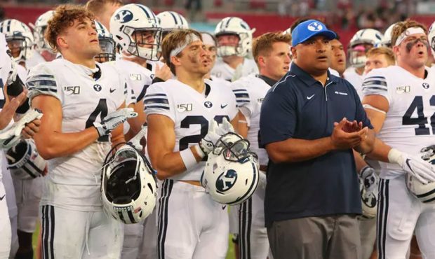 BYU head coach Kalani Sitake leads his team in singing the Cougar fight song to a large crowd of BY...