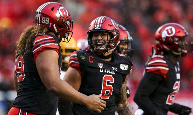Utah Utes defensive end Bradlee Anae (6) celebrates with the rest of the defensive line after stopp...