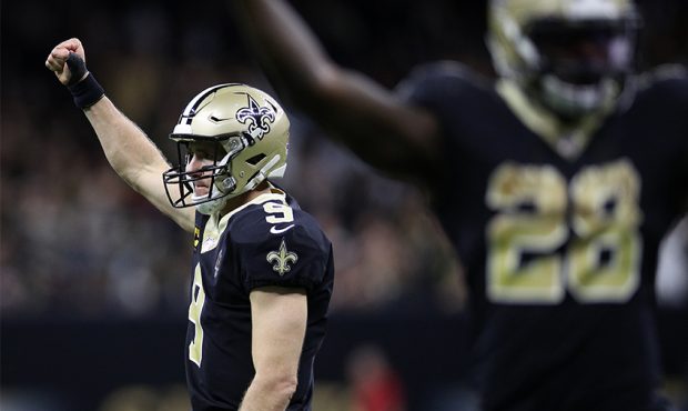 Drew Brees #9 of the New Orleans Saints reacts after a touchdown against the Arizona Cardinals at M...